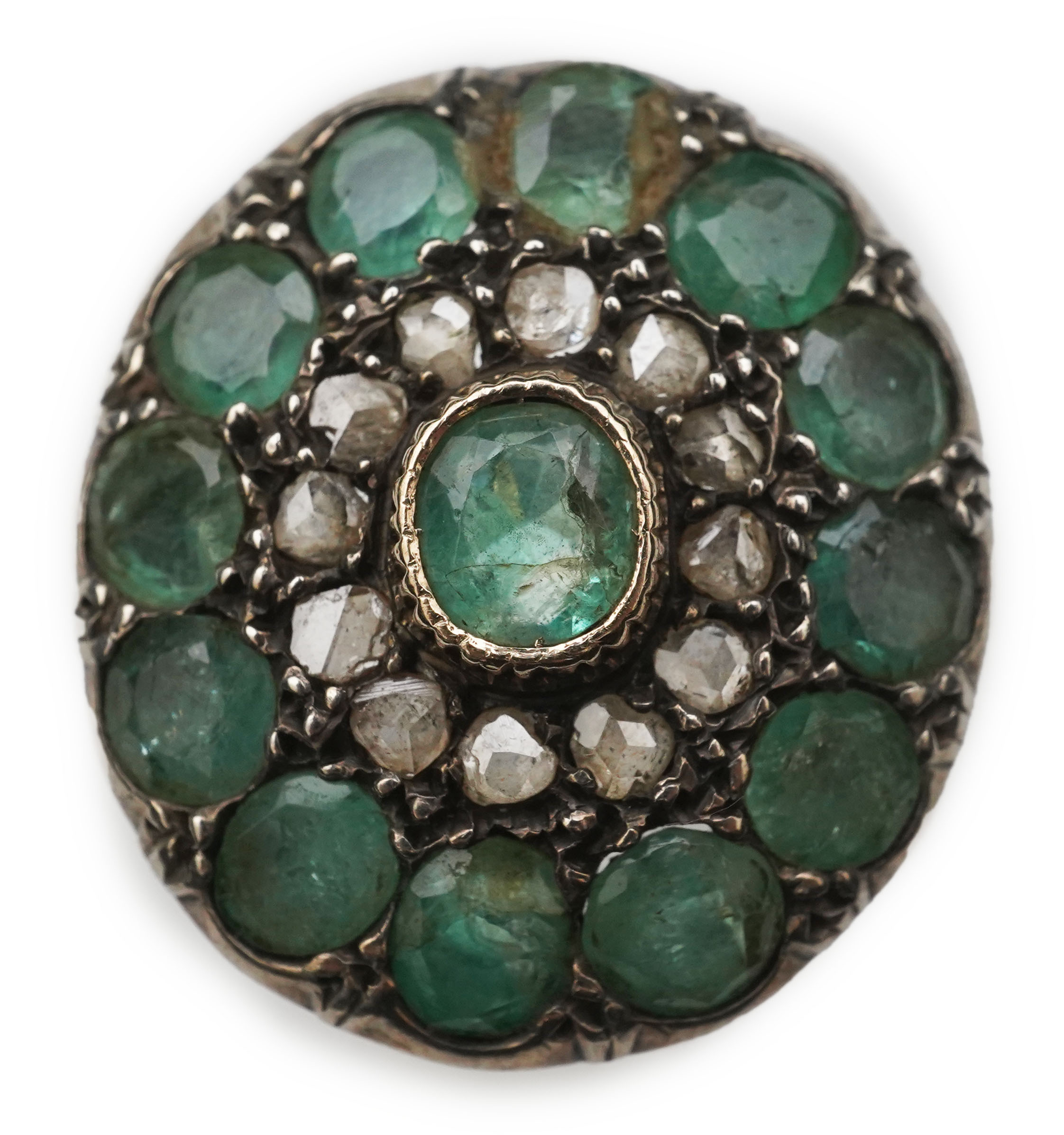 An emerald and diamond ring